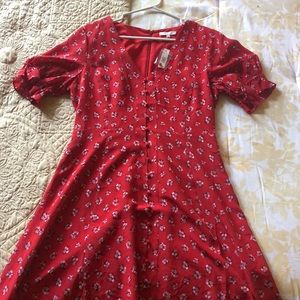 Red, knee-length, floral dress.